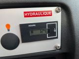 a digital clock on the dashboard of a car
