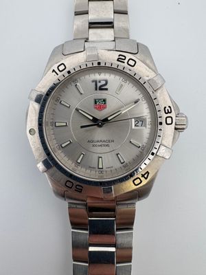 TAG HEUER Bracelet-montre d'homme en acier, boîtier rond à l…