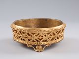 an image of a gold bowl with a design on it