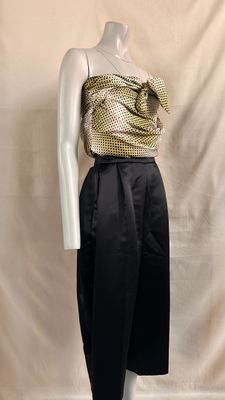 an image of a mannequin wearing a gold top and black skirt