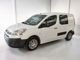 the white van is parked in the white room of the building