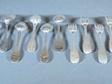 a lot of spoons that are sitting on a table