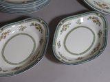 many plates that are sitting on a table