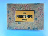 a box with a yellow label on it that says printemps paris