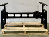 a picture of a wooden pallet with a machine on it