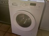 a washer and a dryer in a small kitchen