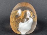 a glass object that is sitting on a black surface