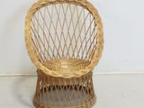 a wicker chair that is sitting on the floor