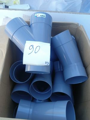 a box full of blue plastic pipes with a price tag on it