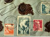 many stamps on a piece of paper with a wax seal