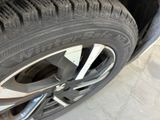 a close up of a tire on a car ' s rim