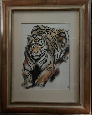 painting of a tiger laying down in a frame on a wall