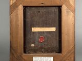 an old picture frame with a red wax stamp on the inside of it