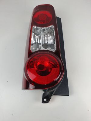 the tail light of a red car on a white surface