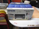 a box of printer sitting on a table next to a stack of chairs