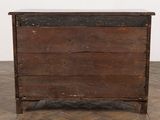 an old wooden chest sitting on top of a hard wood floor