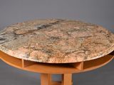 a table with a marble top and wooden base