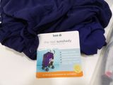 a card with a picture of a baby in a stroller on a table