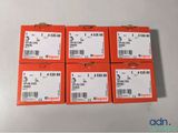 six orange boxes of four different sizes and sizes of wires on a white surface