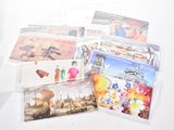a lot of postcards that are on the table