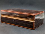 an image of a wooden box with a glass lid on a table