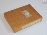a wooden box with a stamp on it sitting on a table
