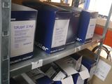 many boxes that are on a shelf in a room