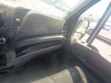 a dirty dashboard of a car in a parking lot