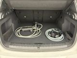 a trunk of a car with a bunch of wires in it