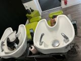 two sinks that are sitting on a table in a room