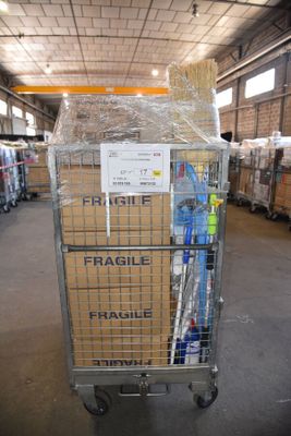 a cart with a lot of items in it in a warehouse
