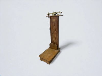 a small wooden stand with a telephone on it