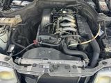 the engine of a car with its hood open and the hood down