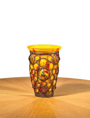 a vase that is sitting on a wooden table