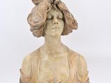 statue of a woman with a hat on her head and a flower in her hair
