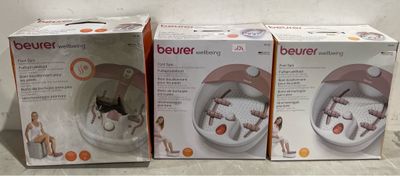 three boxes of beurerr sitting on a counter top