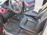 a picture of a car interior with the door open