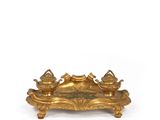 an image of a gold plate with three birds on it