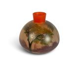 a vase with a painting on it on a white surface