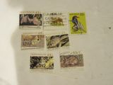 many different stamps on a piece of paper on a table
