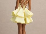 the back of a woman in a yellow dress