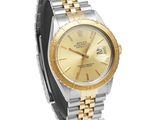 an image of a rolex watch with a gold dial