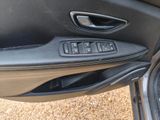 a close up of a car ' s door handle and control panel