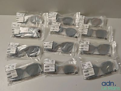a lot of glasses that are sitting on a table