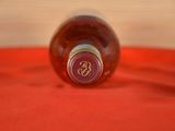 a bottle of wine that is sitting on a table