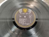 a record with a label on it sitting on a table