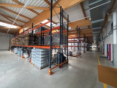 a large warehouse filled with lots of shelves and pallets