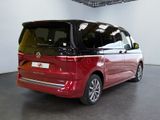 the red van is parked in the showroom of a car showroom