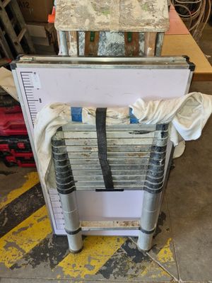 a metal ladder that is sitting on the floor