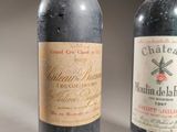 two bottles of wine sitting next to each other on a table